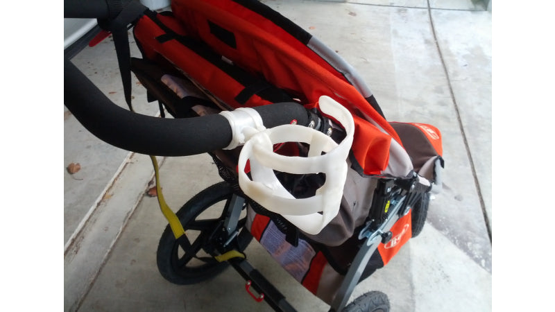 Cup holder for baby stroller handle made with InstaMorph moldable plastic.
