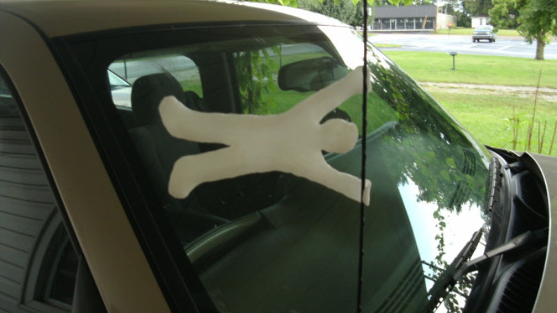 Car antennae decoration in the shape of a man holding on in the wind made with InstaMorph moldable plastic.
