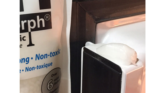 InstaMorph moldable plastic shown as a fix for a fridge door.