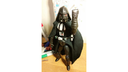 Darth Vadar Star Wars figurine made with InstaMorph moldable plastic. Complete with lightsaber.