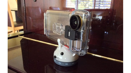 InstaMorph moldable plastic added a holder to a regular mechanical timer to create a selfie panoramic camera stand.