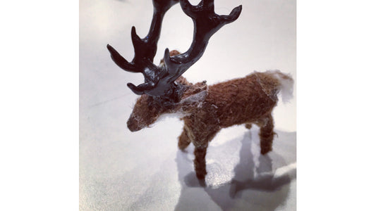 Reindeer figurine sculpture made out of InstaMorph moldable plastic for a school project. Covered in fake fur to appear life-like. With big antlers. 