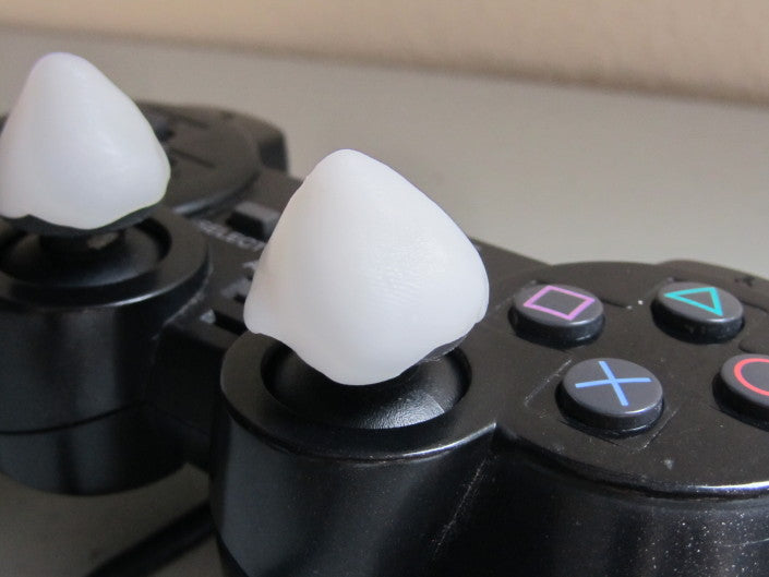 InstaMorph moldable plastic mods made for PlayStation controller on thumb controls.